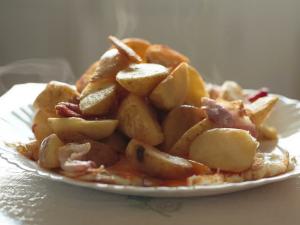 Fried potatoes with lard and onions Fried potatoes with salted lard